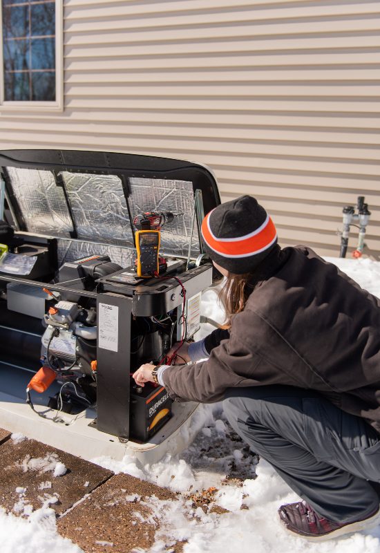 Seidel Electric commercial generator undergoing routine maintenance in freezing weather conditions to ensure optimal performance