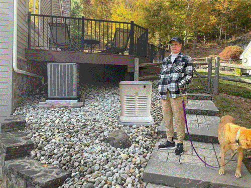 A Man and a dog near a generator, emphasizing generator installation service in Blairstown, NJ