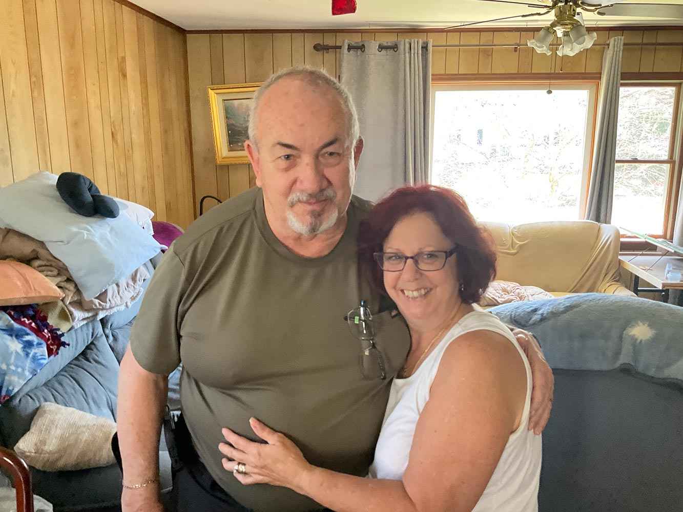 A smiling couple in a cozy home, featuring generator installation and service in Blairstown, NJ