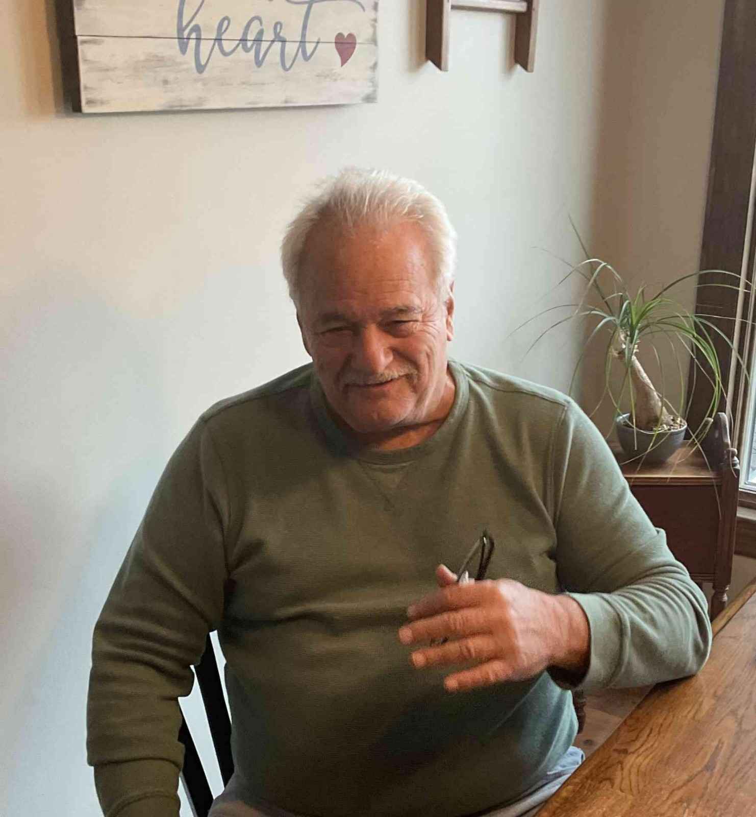 An old man sitting peacefully in his home after generator installation & service in Blairstown, NJ.