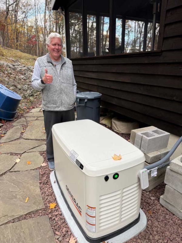 Homeowner beside Generac generator in Blairstown, NJ.