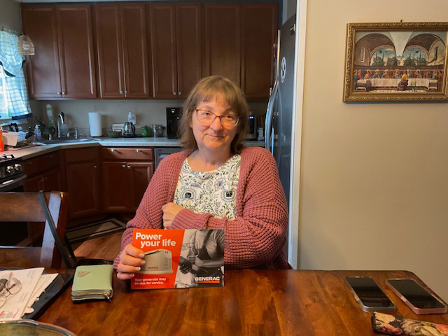 Happy customer holding Power you life flyer.