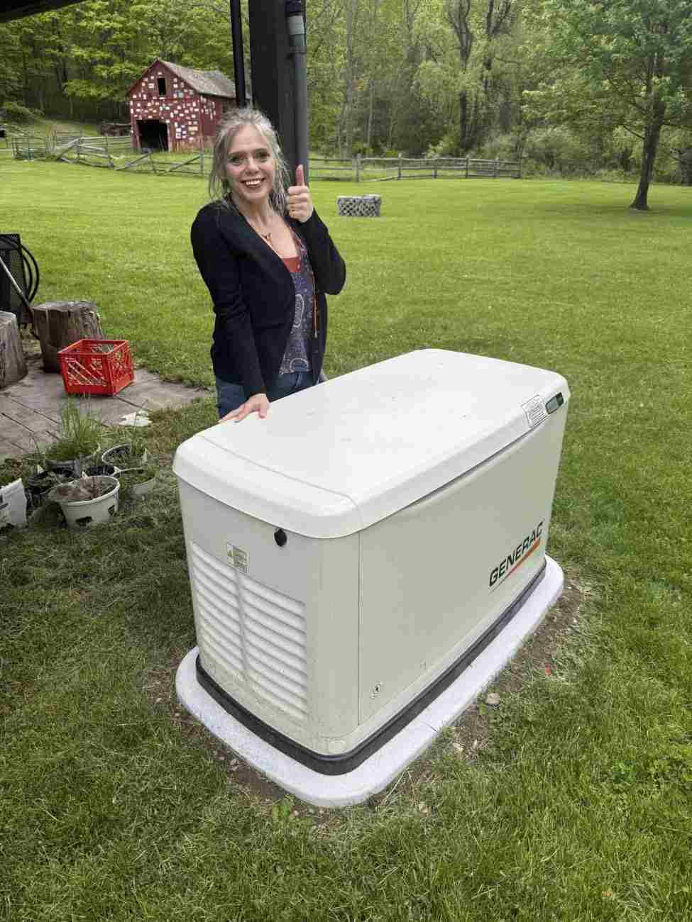 generac-backup-power-happy-client.jpeg- Satisfied client showcasing Generac generator installation Blairstown project