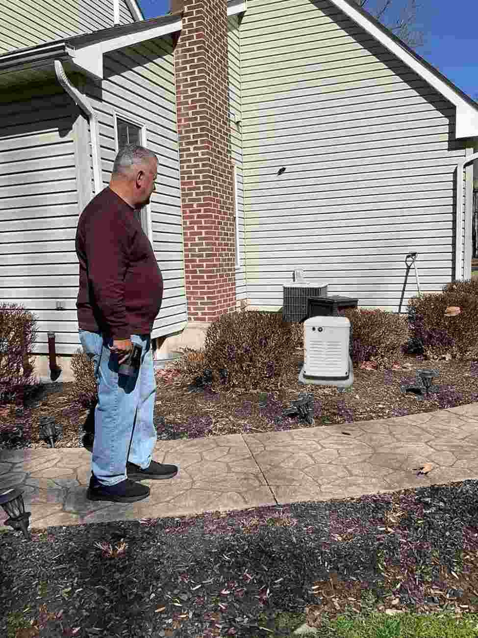 generac-generator-happy-client-installation.jpg Satisfied customer relaxing at home with a Generac generator and electrical services in Blairtown, NJ.