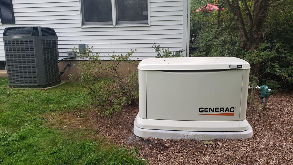 generator outside home in mulch