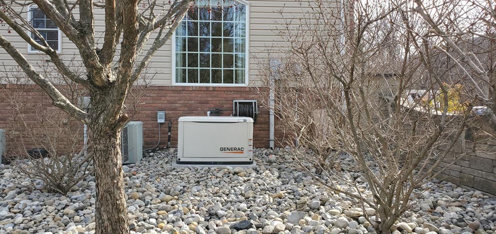 generator outside home in gravel