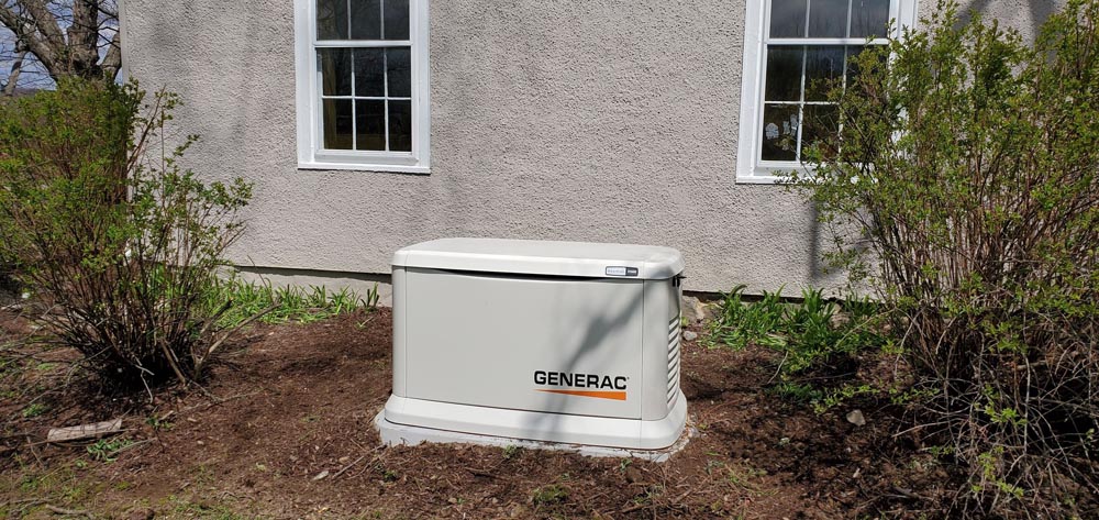 generator outside home in mulch
