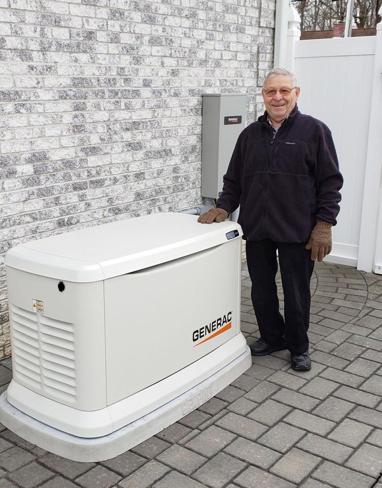 man standing by generator outside home