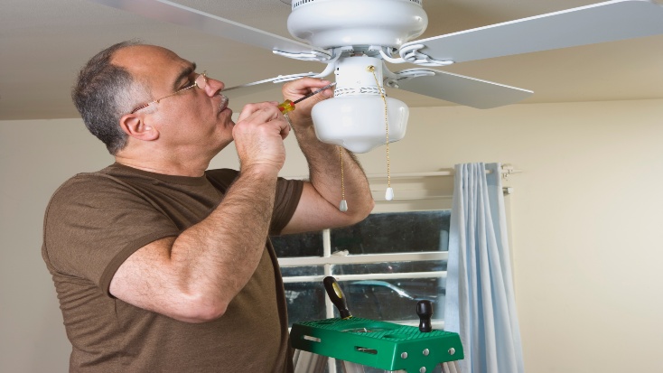 Man Repairing Ceiling Fan in Blairstown, NJ by Seidel Electric