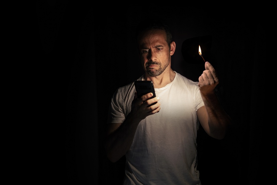 A man lighting the candle