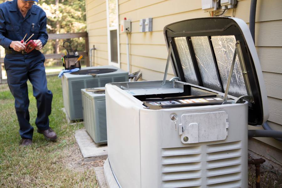 A Technician beside an Air Conditioner Highlighting Generator Repair Services in Blairstown, NJ