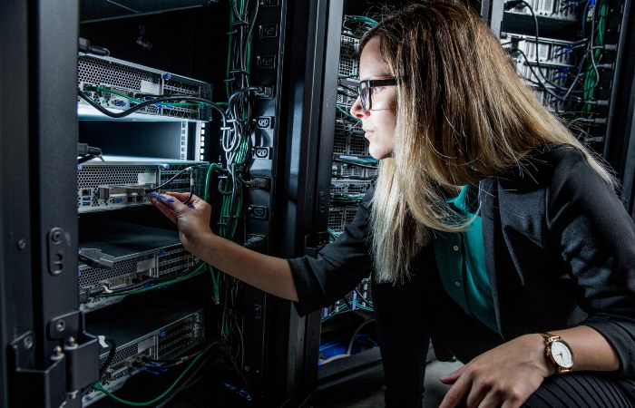 Technician installing a computer network at Seidel Electric